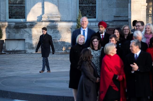 Prime Minister Justin Trudeau walks towards his cabinet to speak to reporters following a swearing in ceremony at Rideau Hall in Ottawa, on Wednesday, Nov. 20, 2019. THE CANADIAN PRESS/Justin Tang