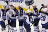 Jacquelyn Martin / The Associated Press
Winnipeg Jets' goalie Ondrej Pavelec (31), of the Czech Republic, is congratulated by teammates including Blake Wheeler (26), Johnny Oduya (29), Bryan Little (18), Aaron Gagnon (21) and Antti Miettinen (20) after winning 3-2 in a shootout against the Washington Capitals in an NHL hockey game in Washington on Thursday.