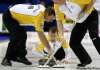 DAVE CHIDLEY / The Canadian Press 
Manitoba skip Jeff Stoughton watches his shot between second Reid Carruthers (left) and lead Steve Gould in draw 3 against Nova Scotia at the Brier Canadian Curling Championship in London, Ont., on Sunday.