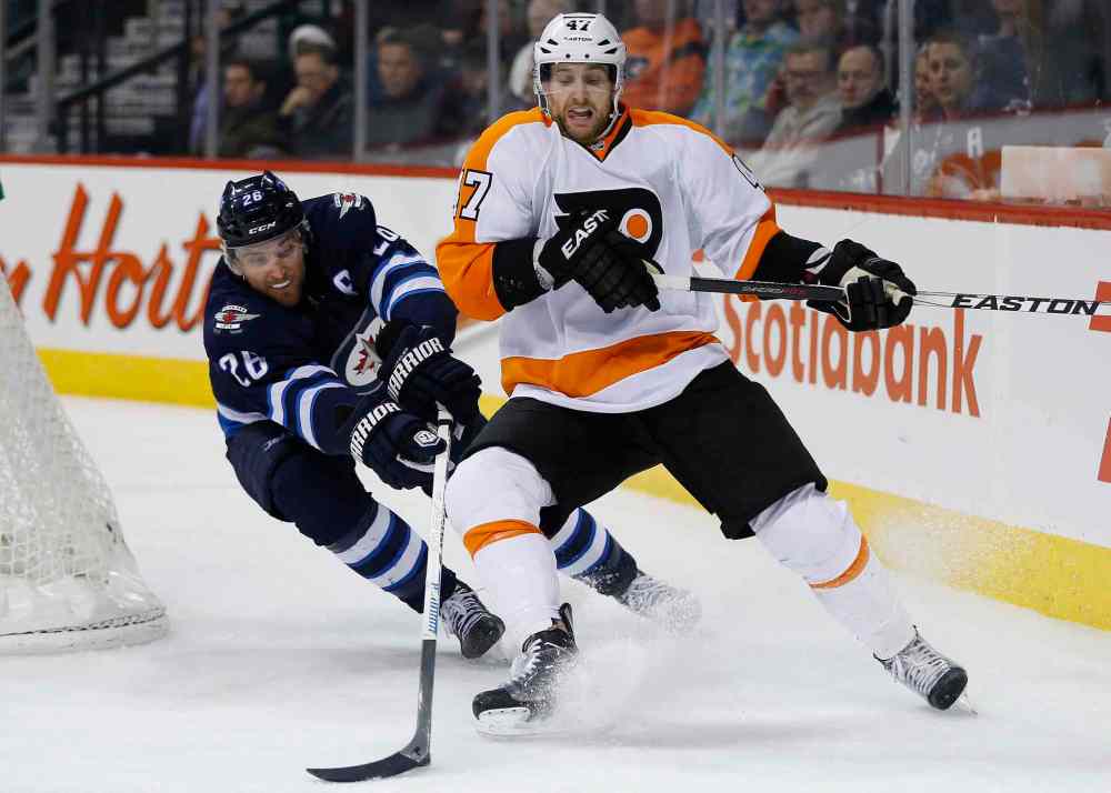 JOHN WOODS / WINNIPEG FREE PRESS
Winnipeg Jets winger Blake Wheeler steals the puck from Philadelphia's Andrew MacDonald during second-period action at the MTS Centre.