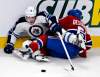 Ryan Remiorz / THE CANADIAN PRESS
Winnipeg Jets' Mike Santorelli reaches for the puck while tangled with Montreal Canadiens' David Desharnais during second-period National Hockey League action in Montreal Thursday.