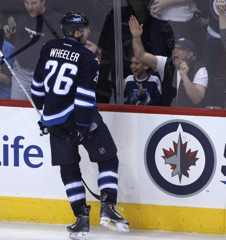 JOE BRYKSA / WINNIPEG FREE PRESS
The Jets’ Blake Wheeler celebrates with MTS Centre fans after his second-period goal against Tampa Bay Tuesday evening.