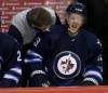 Trevor Hagan / THE CANADIAN PRESS
Winnipeg Jets defenceman Tobias Enstrom reacts after being hit by a Buffalo Sabres player Tuesday in Winnipeg.