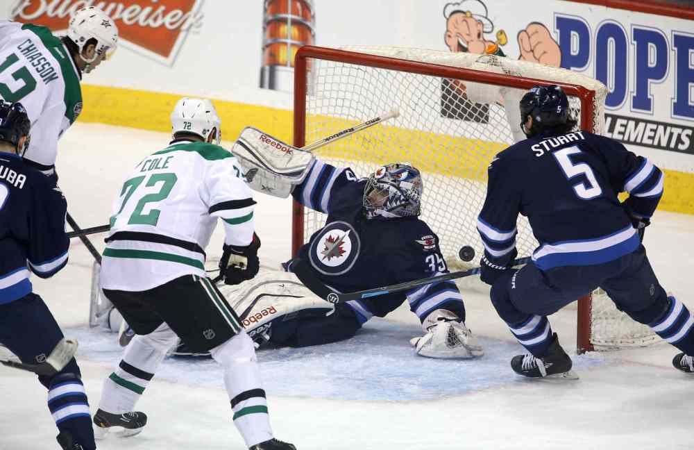 TREVOR HAGAN / THE CANADIAN PRESS
The Dallas Stars Alex Chiasson (12) scores on Winnipeg Jets goaltender Al Montoya in the first period.