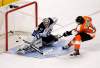 TOM MIHALEK / THE ASSOCIATED PRESS
Winnipeg Jets goaltender Ondrej Pavelec deflects a shot from Philadelphia Flyers' Sean Couturier during the shootout period of their NHL game Tuesday in Philadelphia. The Jets won 2-1.