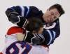 JOHN WOODS / THE CANADIAN PRESS
Winnipeg Jets forward James Wright and Washington Capitals' Steve Oleksy fight during first-period NHL action in Winnipeg on Thursday.