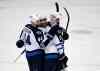 Jae C. Hong / The Associated Press
Winnipeg Jets' Evander Kane, center, celebrates his goal with Zach Bogosian, left, and Jacob Trouba during the second period Tuesday in Anaheim, Calif. The Jets beat the Ducks 3-2.