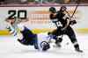 Jae C. Hong / The Associated Press
Winnipeg's Andrew Ladd takes a tumble to the ice while fighting for the puck with Anaheim's Daniel Winnik during the first period at the Honda Center Tuesday.