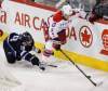 JESSICA BURTNICK / WINNIPEG FREE PRESS
Winnipeg Jets forward Bryan Little dives for the puck as Washington Capitals defenceman Karl Alzner gains control.