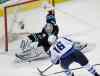 Marcio Jose Sanchez / The Associated Press
San Jose Sharks goalie Alex Stalock (32) stops a shot by Winnipeg Jets' Andrew Ladd (16) during the first period of Thursday's NHL hockey game  in San Jose, Calif.