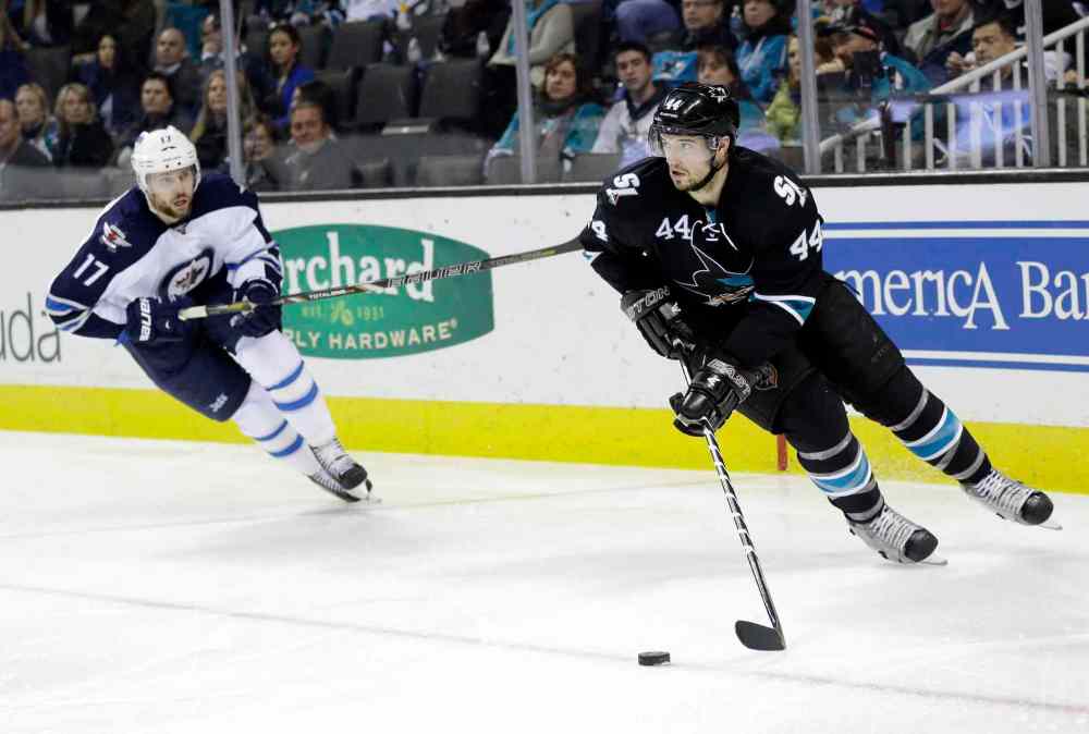 Marcio Jose Sanchez / The Associated Press
San Jose Sharks' Marc-Edouard Vlasic (44) is chased by Winnipeg Jets' James Wright (17) during the second period Thursday's game. The Sharks won 1-0.