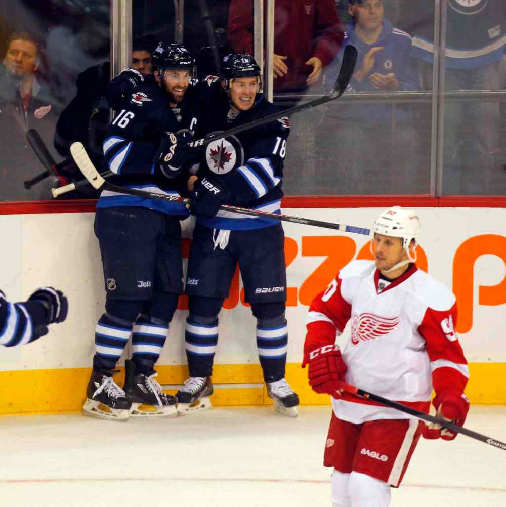 BORIS MINKEVICH / WINNIPEG FREE PRESS
Jets Bryan Little and Andrew Ladd celebrate Little’s goal — his eighth — to open the scoring in the first period Monday night.