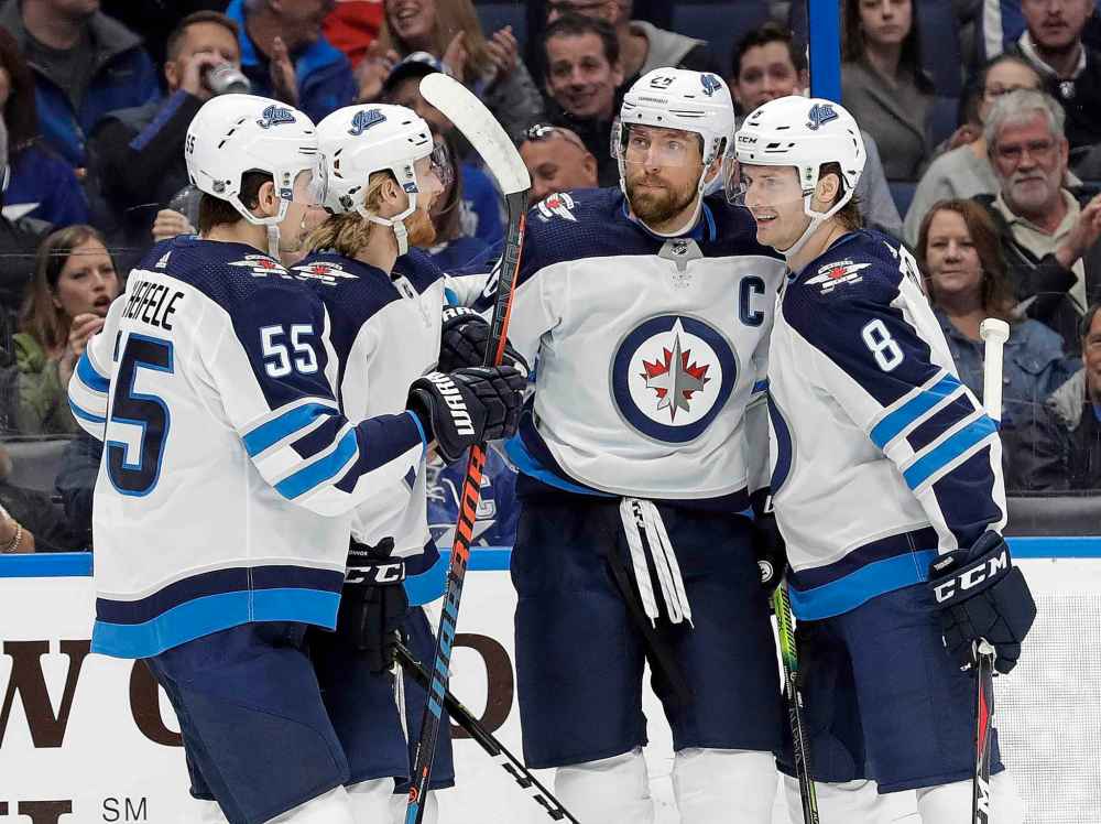 (AP Photo/Chris O'Meara)
Winnipeg Jets right wing Blake Wheeler celebrates his goal against the Tampa Bay Lightning with teammates, including centre Mark Scheifele and defenceman Jacob Trouba, during the first period Tuesday.