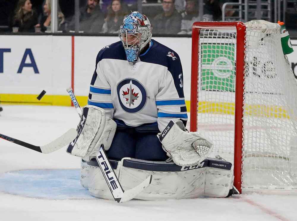 (AP Photo/Chris Carlson)
Winnipeg Jets goaltender Connor Hellebuyck blocks a shot during the second period.