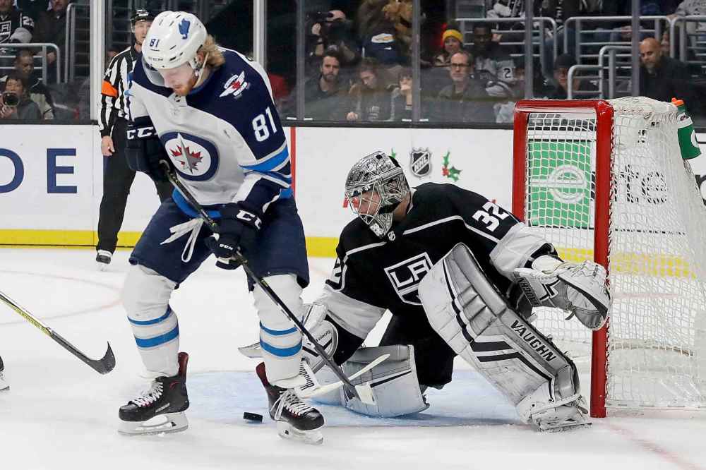 (AP Photo/Chris Carlson)
Los Angeles Kings goaltender Jonathan Quick blocks a shot between the legs of Winnipeg Jets left wing Kyle Connor during the first period.