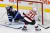 JOHN WOODS / THE CANADIAN PRESS
New Jersey Devils forward Lee Stempniak scores his first of two goals on Jets goaltender Connor Hellebuyck during first-period action Saturday at the MTS Centre.