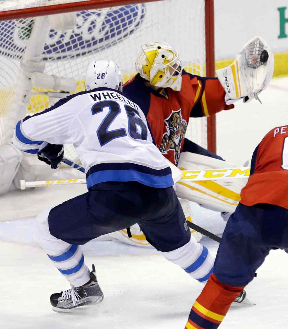 CP
Florida Panthers goalie Roberto Luongo, right, blocks a shot by Winnipeg Jets right wing Blake Wheeler (26) during the second period of an NHL hockey game, Saturday.