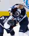 David Zalubowski / The Associated Press files
Winnipeg Jets left wing Nikolaj Ehlers, right, of Denmark, fights with Colorado Avalanche defenseman Tyson Barrie during the third period of Saturday's game. The Jets won 4-2.