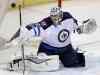 Tom Gannam / The Associated Press
Ondrej Pavelec makes a stick save during the third period against the St. Louis Blues Tuesday night.