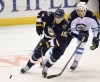 Bill Boyce / The Associated Press
St. Louis Blues' Jon Lehtera (12), of Finland, skates past Winnipeg Jets' Adam Lowry (17) during the third period of Tuesday's game, which the Jets won 1-0.