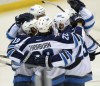 Bill Boyce / The Associated Press Files
Winnipeg's Chris Thorburn is congratulated for his winning goal against the St. Louis Blues Tuesday. He later displayed his emotions in the locker-room.