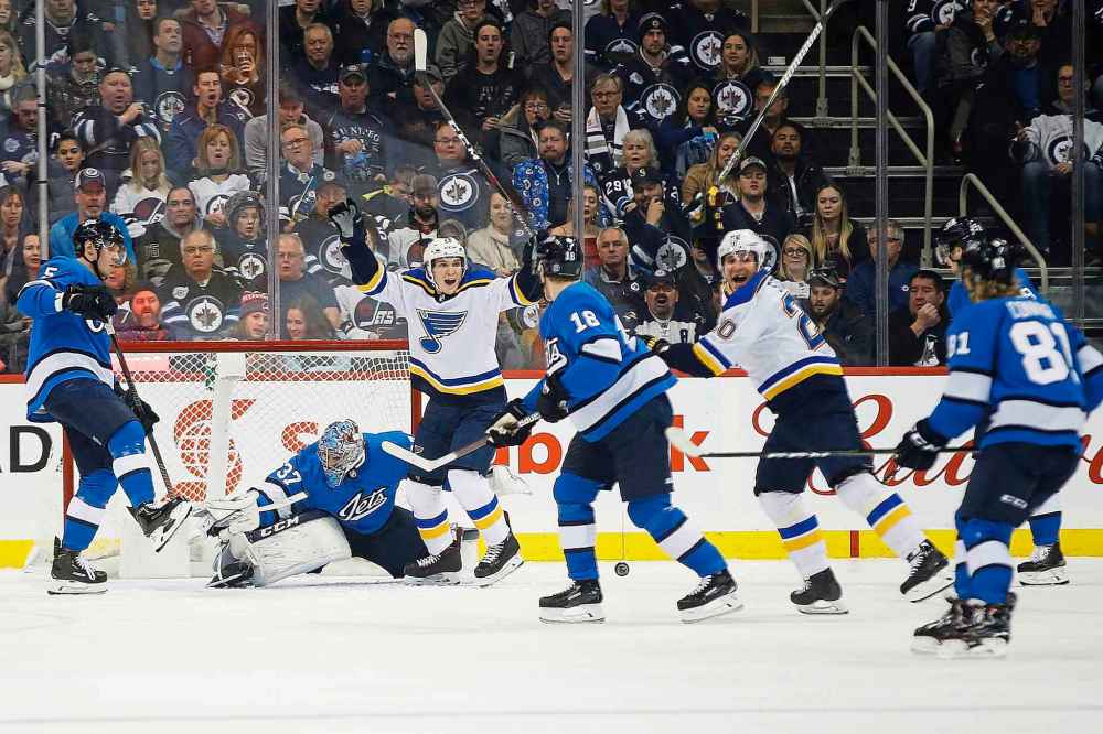 THE CANADIAN PRESS/John Woods
St. Louis Blues' Robert Thomas and Alexander Steen celebrate Steen's goal on Winnipeg Jets goaltender Connor Hellebuyck during the second period in Winnipe, Friday. The goal would prove to be the game winner as the Blues would go on to win 1-0.