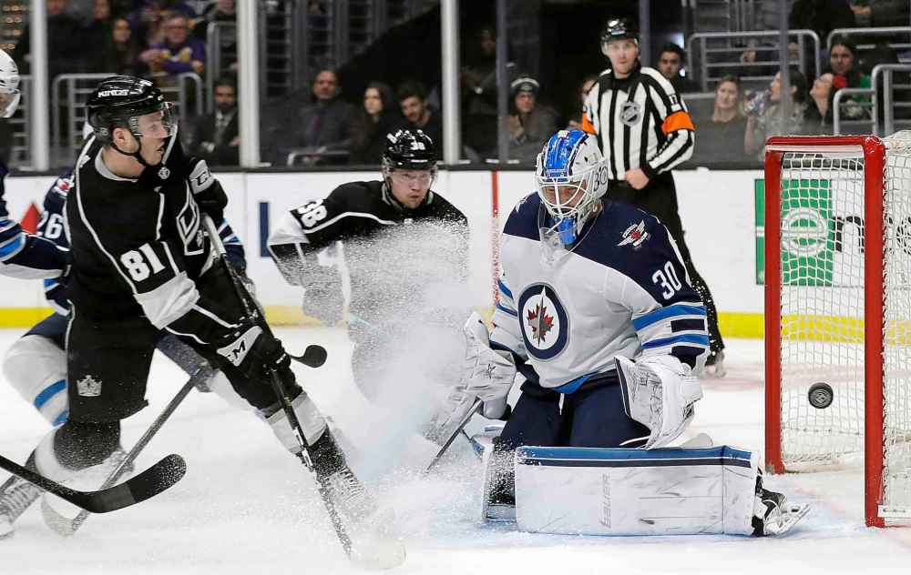 (AP Photo/Marcio Jose Sanchez)
Winnipeg Jets goaltender Laurent Brossoit stops a shot from Los Angeles Kings' Matt Roy during the second period.
