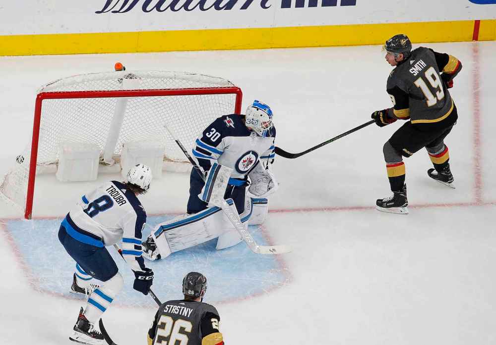 (AP Photo/John Locher)
Vegas Golden Knights right wing Reilly Smith scores on Winnipeg Jets goaltender Laurent Brossoit during the first period Thursday in Las Vegas.