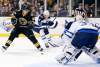 Michael Dwyer / The Associated Press
Bruins winger Brad Marchand tries to get a shot off on Jets goalie Ondrej Pavelec as Paul Postma defends during the second period Monday. Marchand's first-period marker tied the game.
