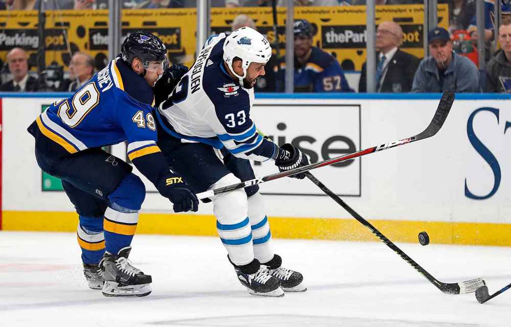 (AP Photo/Jeff Roberson)
Winnipeg Jets defenceman Dustin Byfuglien and St. Louis Blues centre Ivan Barbashev battle for the puck during the first period.