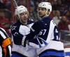 Alex Brandon / The Associated Press
Winnipeg Jets' centre Bryan Little (18) celebrates his goal with right wing Michael Frolik (67), during the first period of an NHL hockey game against the Washington Capitals on Thursday.