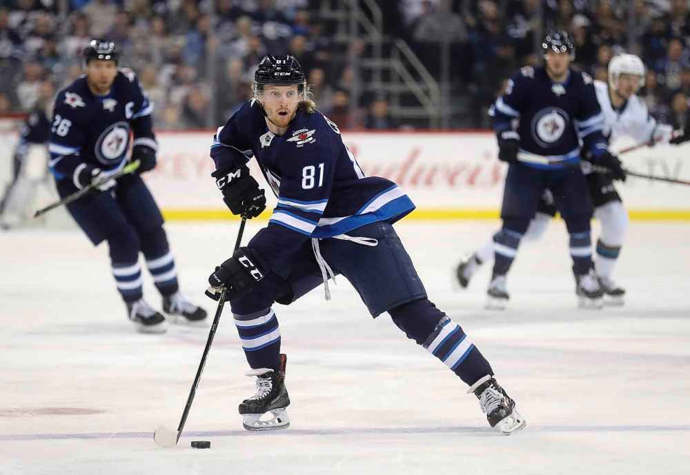 THE CANADIAN PRESS/Trevor Hagan
Winnipeg Jets' Kyle Connor carries the puck into the San Jose Sharks' zone during the second period.