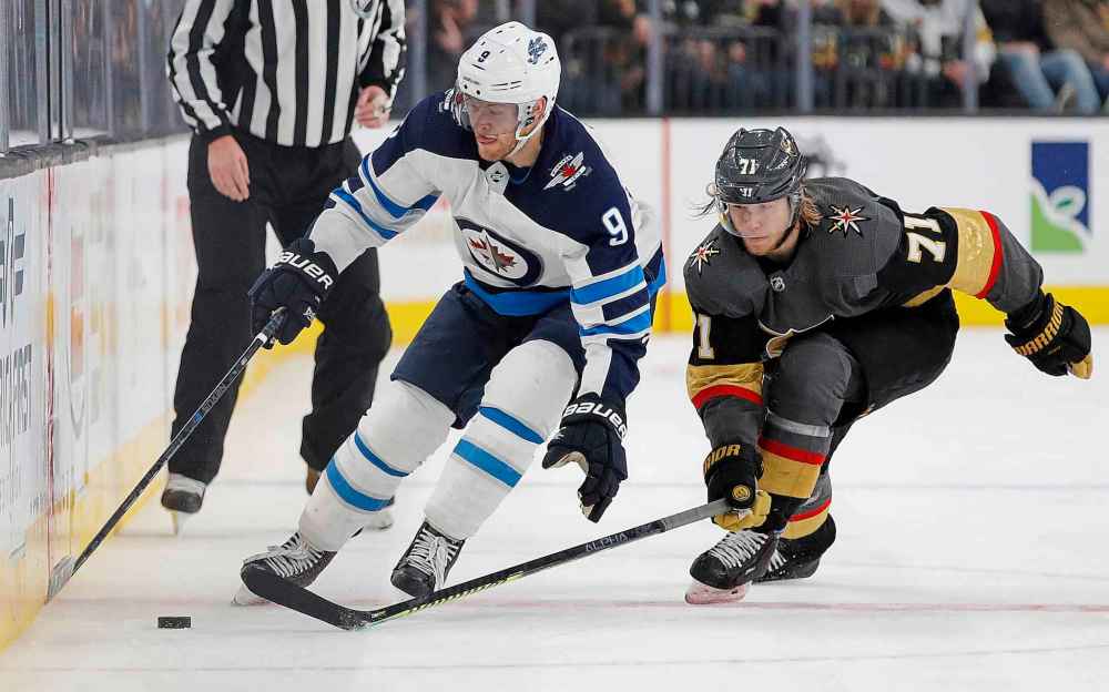 CP
Winnipeg Jets winger Andrew Copp and Vegas Golden Knights centre William Karlsson vie for the puck during the third period.
