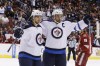 Ross D. Franklin / The Associated Press
Winnipeg Jets' Andrew Ladd, right, celebrates his goal against the Phoenix Coyotes with teammate Michael Frolik, left, of the Czech Republic, during the first period of Tuesday's game. The Jets won the game 2-1.