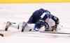 Ross D. Franklin / The Associated Press
Winnipeg Jets' Evander Kane grabs for his injured right knee as he stays on the ice during the first period of an NHL hockey game against the Arizona Coyotes Thursday, Oct. 9, 2014, in Glendale, Ariz.
