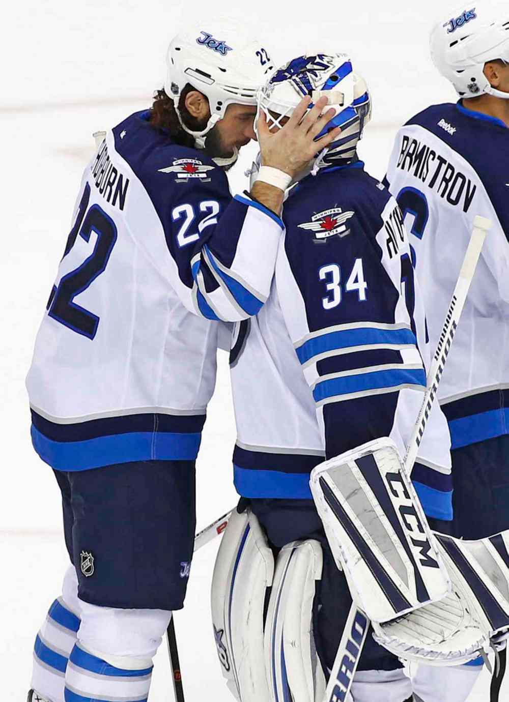 Rich Schultz / The Associated Press
Winnipeg Jets forward Chris Thorburn (22) congratulates goalie Michael Hutchinson (34) after their 3-1 win over the New Jersey Devils in an NHL hockey game in Newark, N.J.