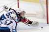 Winnipeg Jets centre Mark Scheifele scores the winner against New Jersey Devils goaltender Keith Kincaid in overtime Saturday. 
 JULIO CORTEZ / THE ASSOCIATED PRESS