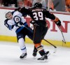 Chris Carlson / The Associated Press files 
Anaheim Ducks left wing Matt Beleskey, right, gives Winnipeg Jets defenceman Toby Enstrom a rough ride during the second period of Game 1 Thursday night. The Jets played a solid game Thursday and won't alter their plan.