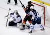 Chris Carlson / The Associated Press
Jets goalie Ondrej Pavelec blocks a shot as defenceman Jacob Trouba and  Ducks forward Patrick Maroon look for a rebound during first-period action.