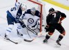 Chris Carlson / The Associated Press
Jets goalie Ondrej Pavelec stymies Ducks center Andrew Cogliano.