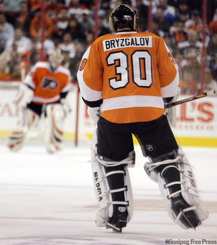 Tom Mihalek / the associated press
Philadelphia Flyers goalie Ilya Bryzgalov skates out to the net to replace Sergie Bobrovsky during the second period of Thursday's high-scoring affair against the Jets.