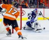 Tom Mihalek / The Associated Press 
Philadelphia Flyers' Wayne Simmonds (17) makes a wrist shot blocked by Winnipeg Jets goalie Michael Hutchinson (34) in the second period.