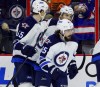 Tom Mihalek / the associated press files
Winnipeg's Mathieu Perreault (85) looks up to admire the scoreboard replay of his first-period goal in Philly Thursday night.