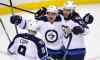 Charles Krupa / The Associated Press
Winnipeg Jets center Nicolas Petan, center, celebrates with Chris Thorburn (22) and Andrew Copp (9) after his goal against Boston Bruins goalie Tuukka Rask, Thursday, Oct. 8.