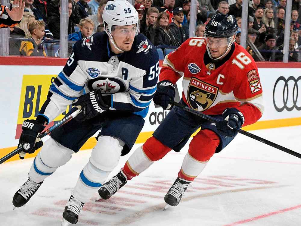 (Martti Kainulainen/Lehtikuva via AP)
Finnish forward, Aleksander Barkov, right, of the Florida Panthers chases Mark Scheifele Thursday.