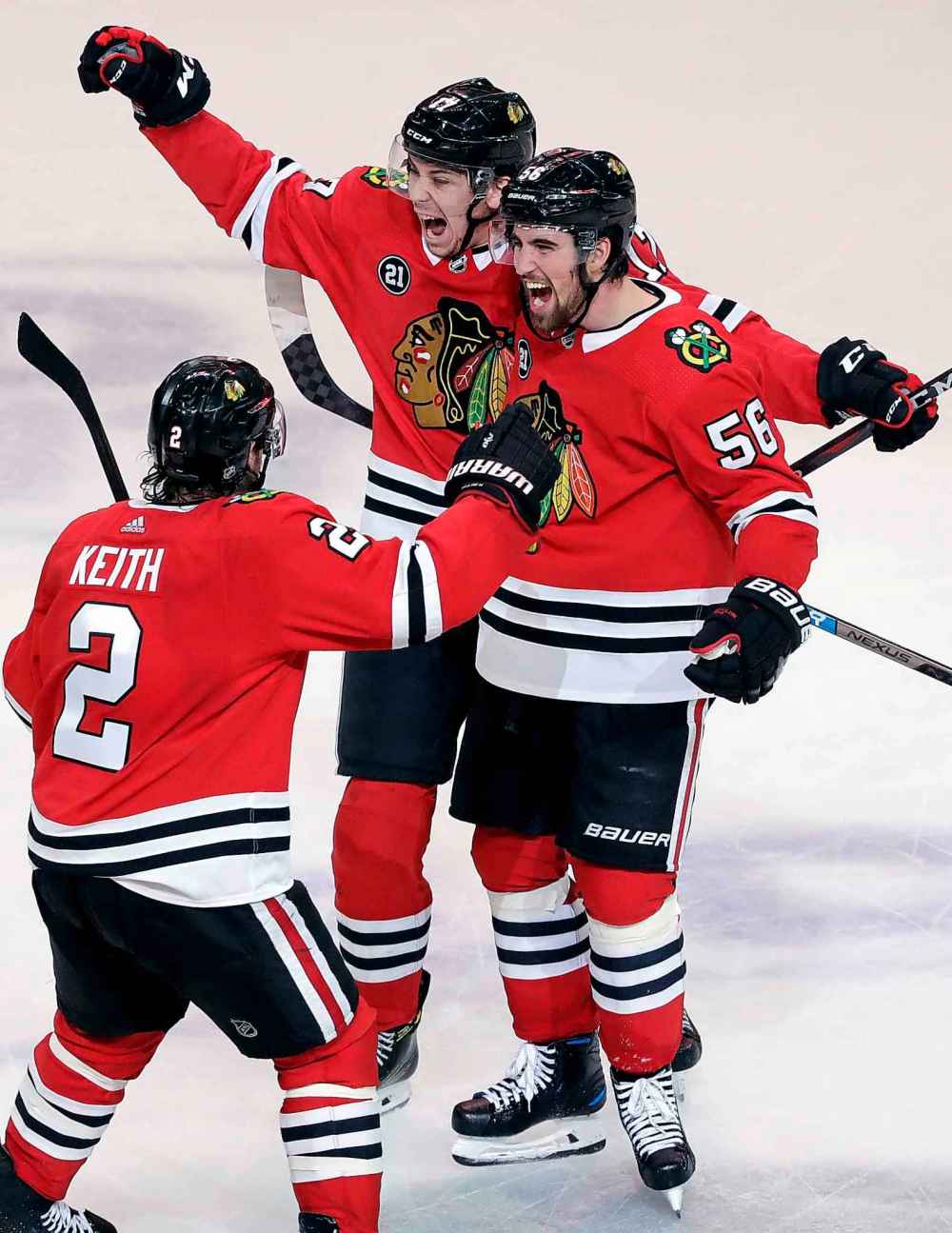 (AP Photo/Nam Y. Huh)
Chicago Blackhawks defenceman Erik Gustafsson (56) celebrates with teammates Dylan Strome and Duncan Keith after scoring the game-tying goal with 7.5 seconds remaining in regulation time, Friday.