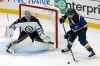 (AP Photo/Scott Kane)
Jets goaltender Connor Hellebuyck wards off St. Louis Blues winger Pat Maroon during the third period.