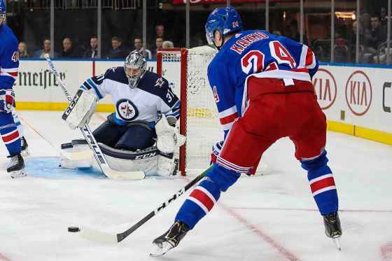 (AP Photo/Mary Altaffer)Winnipeg Jets goaltender Connor Hellebuyck watches New York Rangers right wing Kaapo Kakko   during the second period Thursday, at Madison Square Garden in New York.