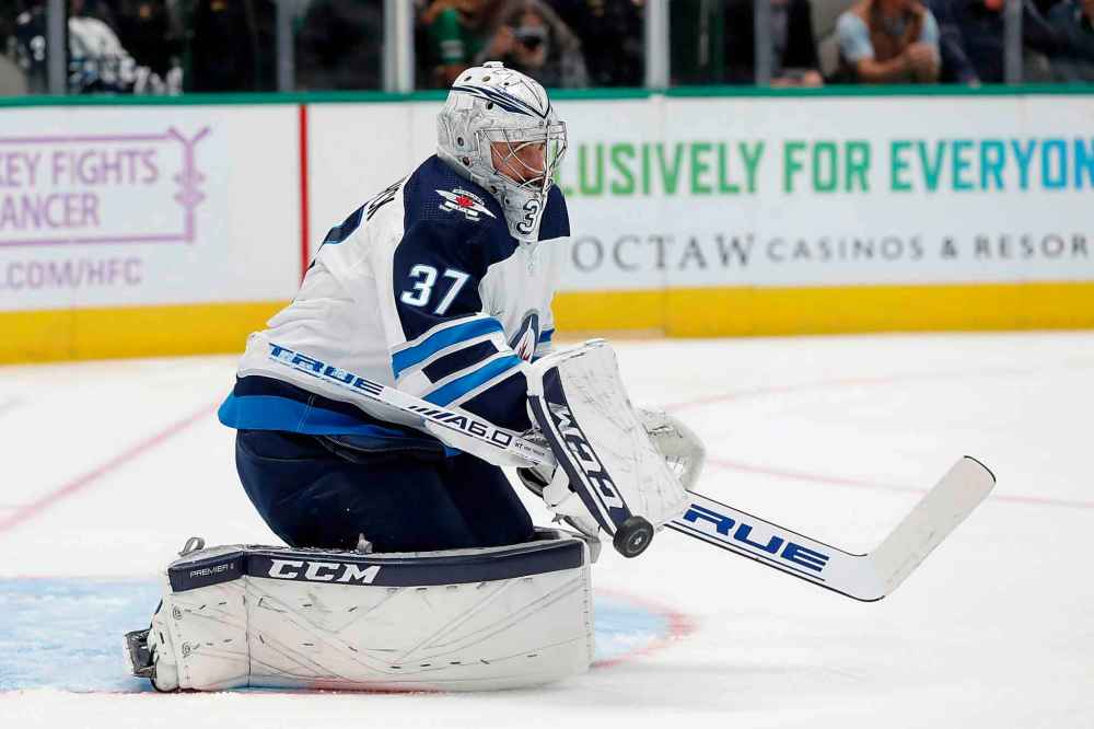(AP Photo/Tony Gutierrez)
Winnipeg Jets goaltender Connor Hellebuyck blocks a shot from the Dallas Stars in the first period.