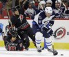 Gerry Broome / The Associated Press
Carolina Hurricanes' Jay McClement (18) and Tim Gleason collide as Winnipeg Jets' Blake Wheeler (26) skates with the puck during the first period in Raleigh, N.C., Thursday.